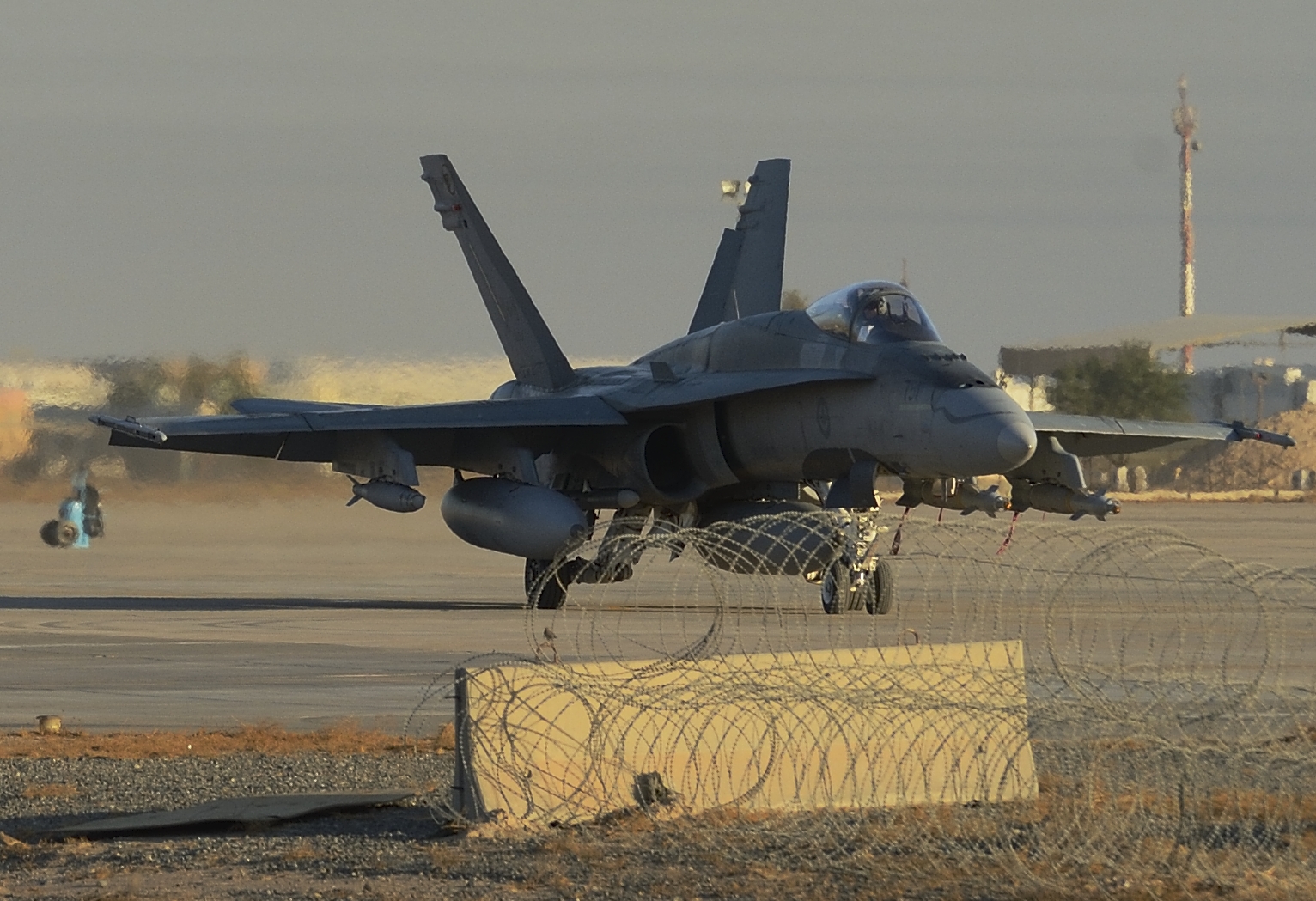 Kuwait. 9 November 2014 – A Canadian Armed Forces CF-18 fighter jet in Kuwait taxis to takeoff for a morning mission over Iraq during Operation IMPACT. (Photo IS2014-7535-02 by Canadian Forces Combat Camera, DND)