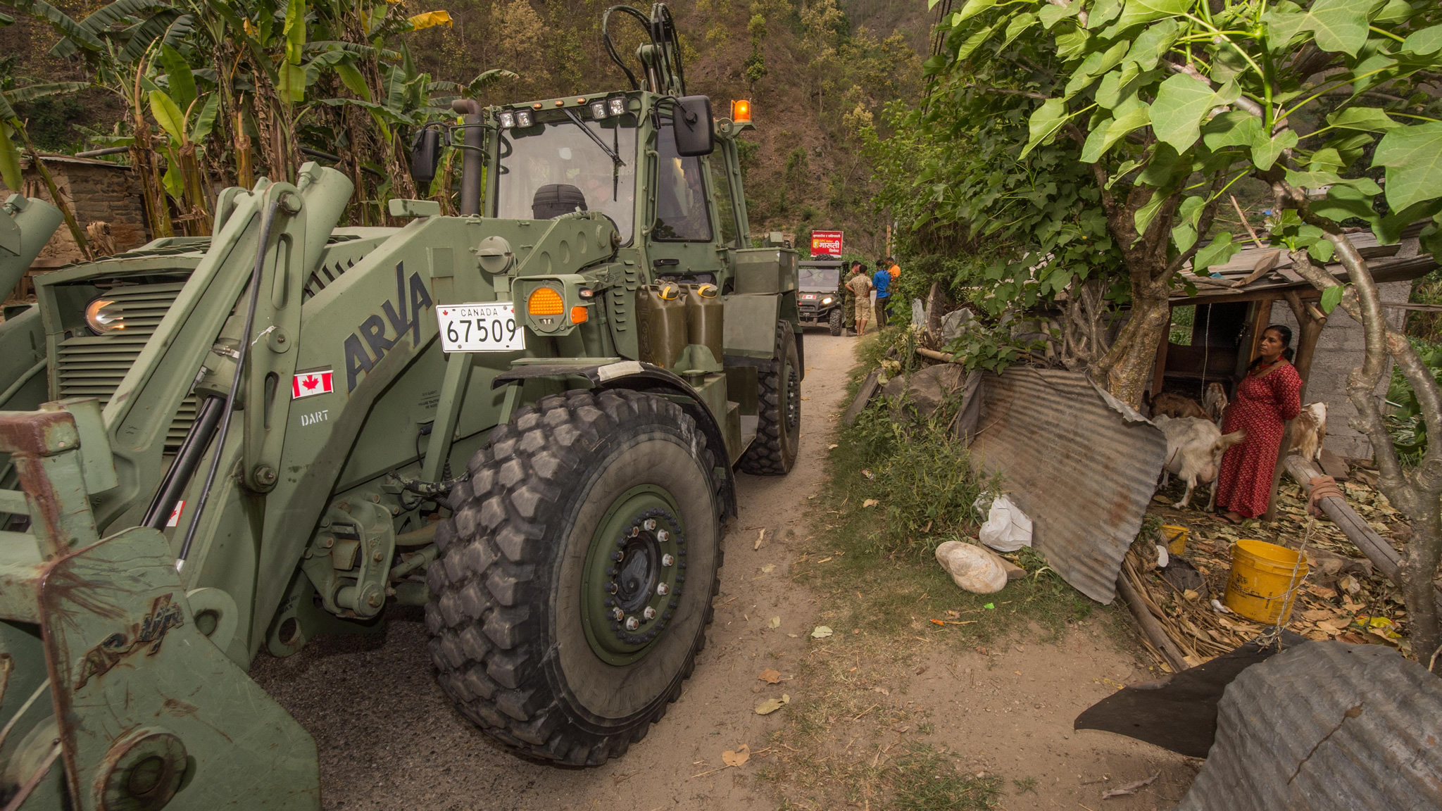 Members of the DART combat engineering team leading a versatile vehicle engineering (VPG), opens the passage to the village of Dolkha, Sindhupalchok district in Nepal, as part of Operation RENAISSANCE 15-1, May 7, 2015.
Photo: Sgt Yannick Bedard, Canadian Forces Joint Imagery Centre